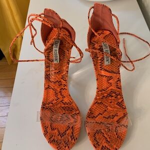 CAPE Robbin orange/black pattern shoes with straps the go up the leg size 7M.